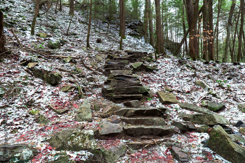 Hiking the Fiery Gizzard trail up mountain rock steps with a winter scene. In South Cumberland State Park, Tracy City, Tennessee USA. photo