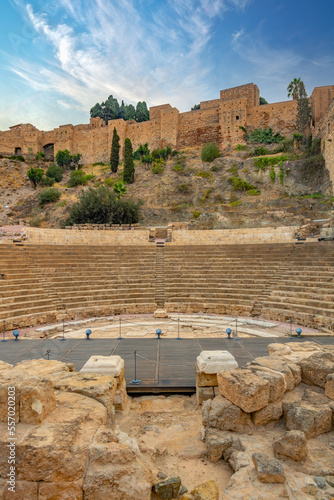 Panorama view from  C/ Alcazabilla street at Old Roman theater in Malaga and The Alcazaba, citadel of Malaga City in the light of a beautiful autumn sky.. in the morning, Malaga, Spain