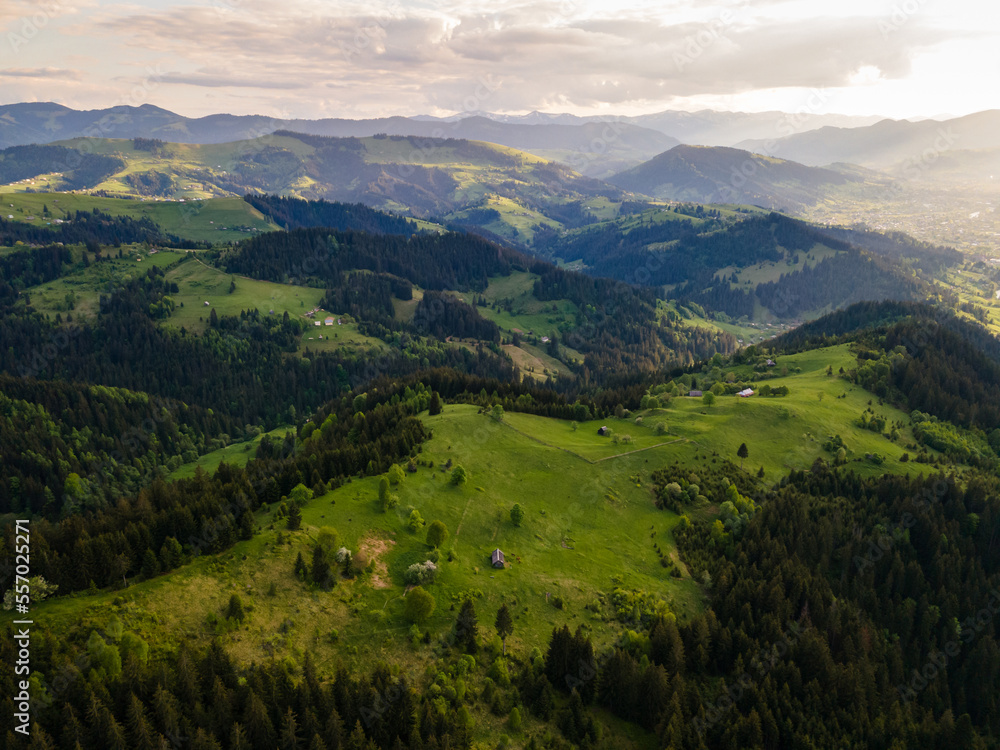 Carpathian mountains summer landscape, seasonal natural background with green hills, blue sky and white clouds. Panoramic view