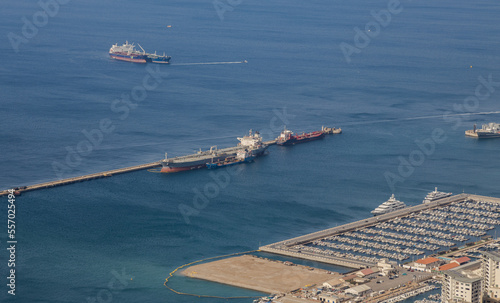View from the Rock of Gibraltar to the bay of Gibraltar full of ships on the roadstead and The Port of Algeciras. Incredible skyline, blue sky with amazing clouds. Gibraltar, UK
