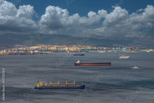 View from the Rock of Gibraltar to the bay of Gibraltar full of ships on the roadstead and The Port of Algeciras. Incredible skyline, blue sky with amazing clouds. Gibraltar, UK