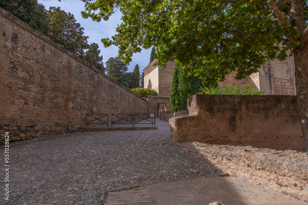 Alhambra de Granada. Palace and fortress of Granada. Ramparts, interiors, buildings, towers, courtyards of a medieval fortress in the Arab, Moorish style.                                              