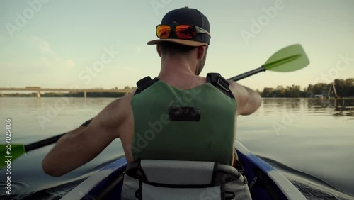 skilled canoeist practicing watersport on canoe