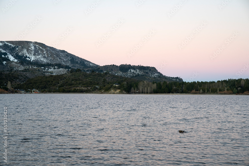 View of the mountains and Alumine lake at sunset.
