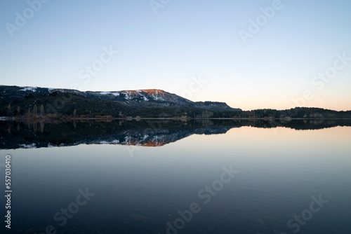 Panorama view of Lake Aluminé and the Andes mountains in the background, at sunset, in Villa Pehuenia, Patagonia Argentina.