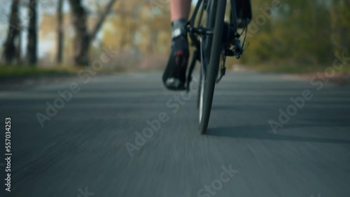 Cyclist rides bicycle on dedicated cycling path	