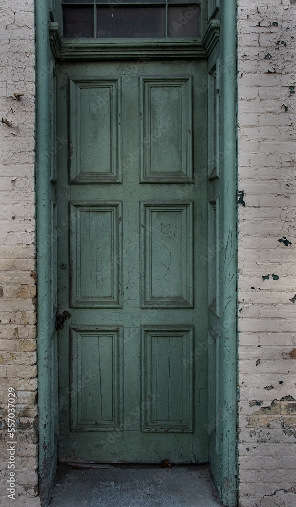 old green with brick wallwooden door