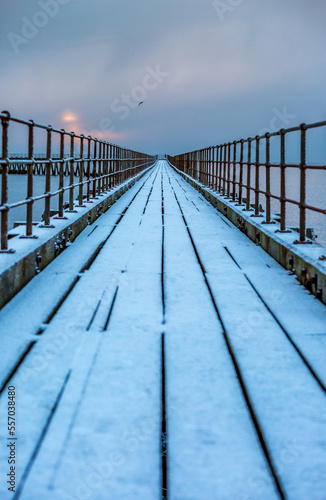A freezing, snowy morning at Blyth beach at the old wooden Pier stretching out to the North Sea © Paul Jackson