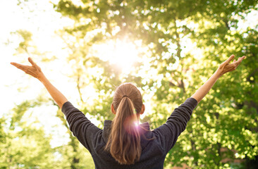 Young woman feeling alive feel good in nature 