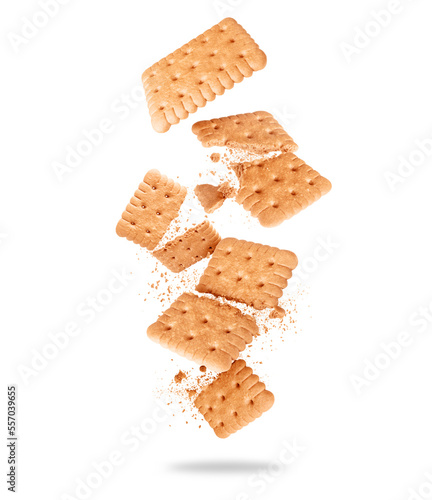 Delicious crispy biscuit crushed in the air close-up on a white background