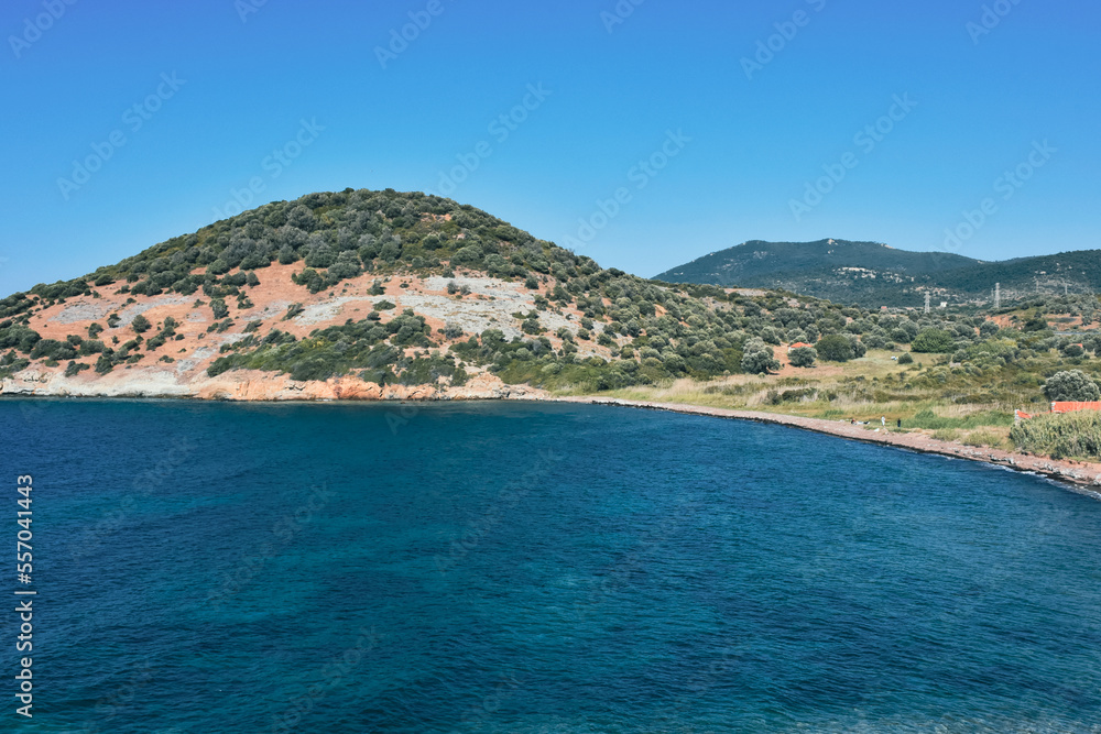 A virgin bay in İzmir Foça. Aegean sea, mountains and natural vegetation of the Aegean covered with maquis. Antique Phokaia in Izmir