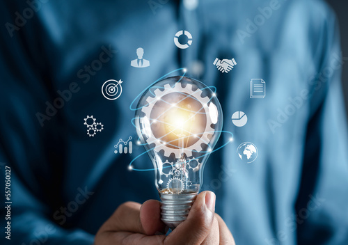 Man hand holding lightbulb with learning educate which for mind, creative, idea, innovation, motivation planning development leadership and customer target group concept...