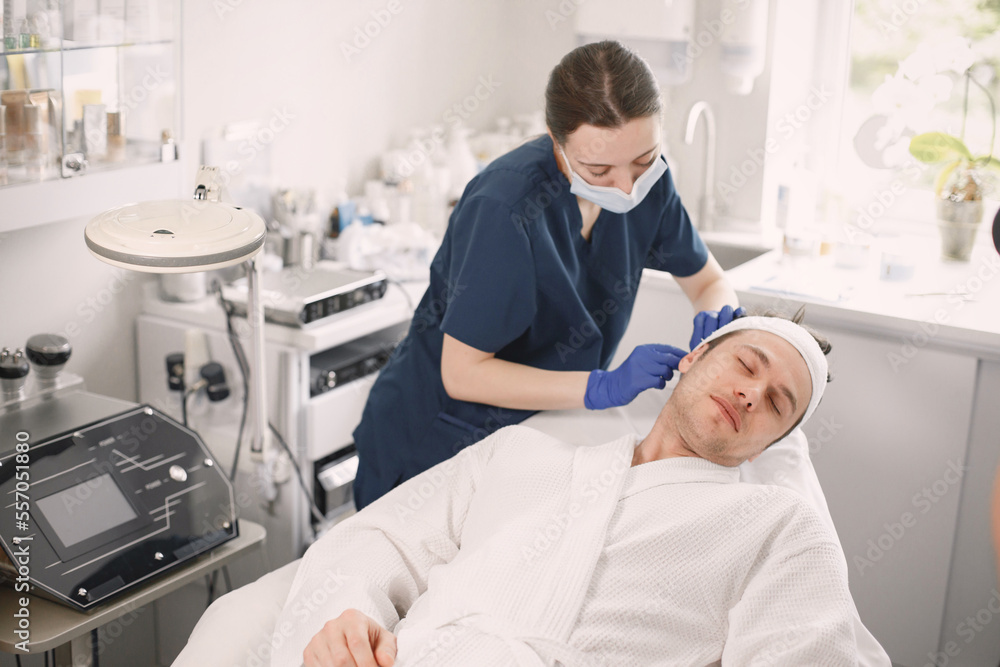 Man in cosmetologist cabinet is going to recieve a skincare procedure Man in cosmetologist cabinet is going to recieve a skincare procedure