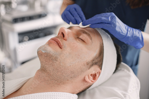 Close-up on a man in cosmetologist cabinet has a skincare procedure