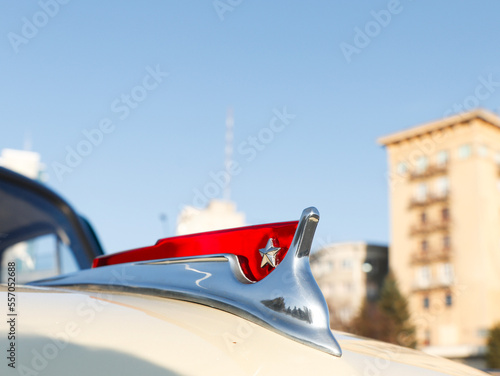 Statuette with the flag of the USSR on the hood of a vintage retro car