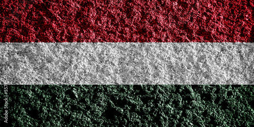 Hungary flag on a textured background. conceptual collage.