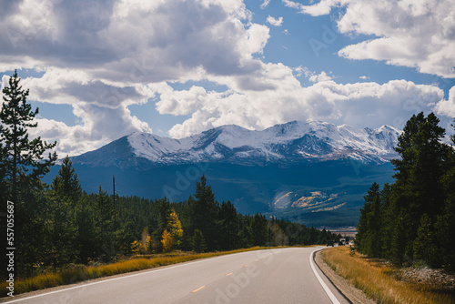 Road trip imagery - driving on an open road through the Colorado Rocky Mountains in the fall
