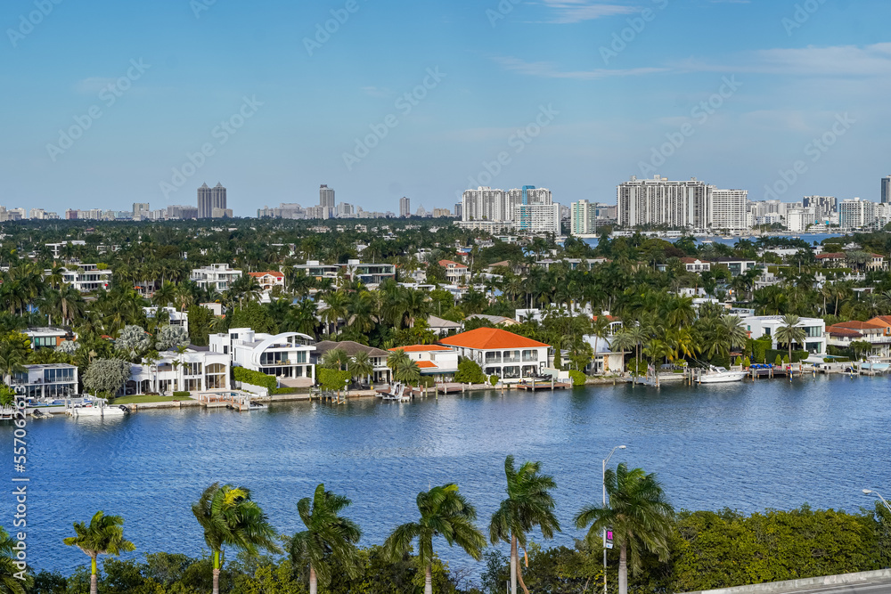 Fototapeta premium Beautiful aerial panoramic view of the city of Miami, its buildings, marina, yachts and luxurious suburbs houses