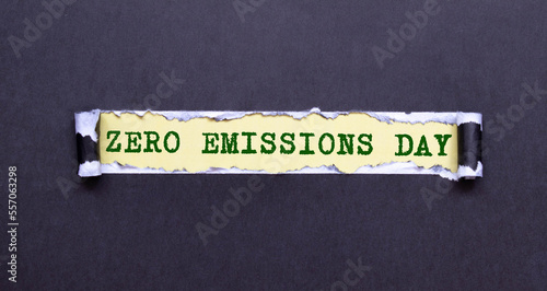 text ZERO EMISSIONS DAY on black torn paper. Environment concept.