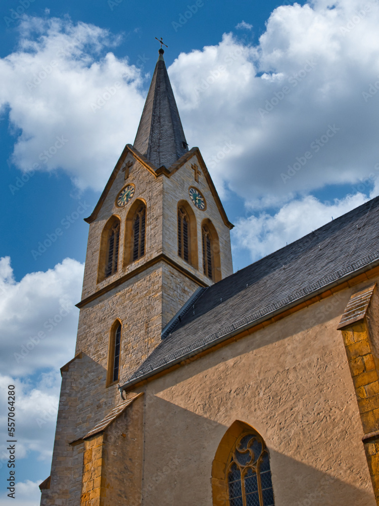 Fototapeta premium Tower of the collegiate church in Bielefeld taken from below on a beautiful day