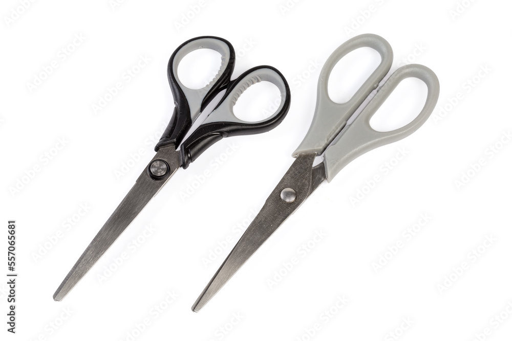Two pair stainless steel universal scissors on a white background Two pair stainless steel universal scissors on a white background