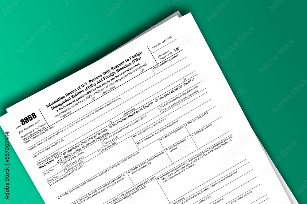 Form 8858 documentation published IRS USA 09.30.2021. American tax document on colored Form 8858 documentation published IRS USA 09.30.2021. American tax document on colored