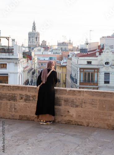 Visiting Valencia in Spain. View of a young traveler enjoying the urban landscape of Valencia, (Spain - Europe). photo