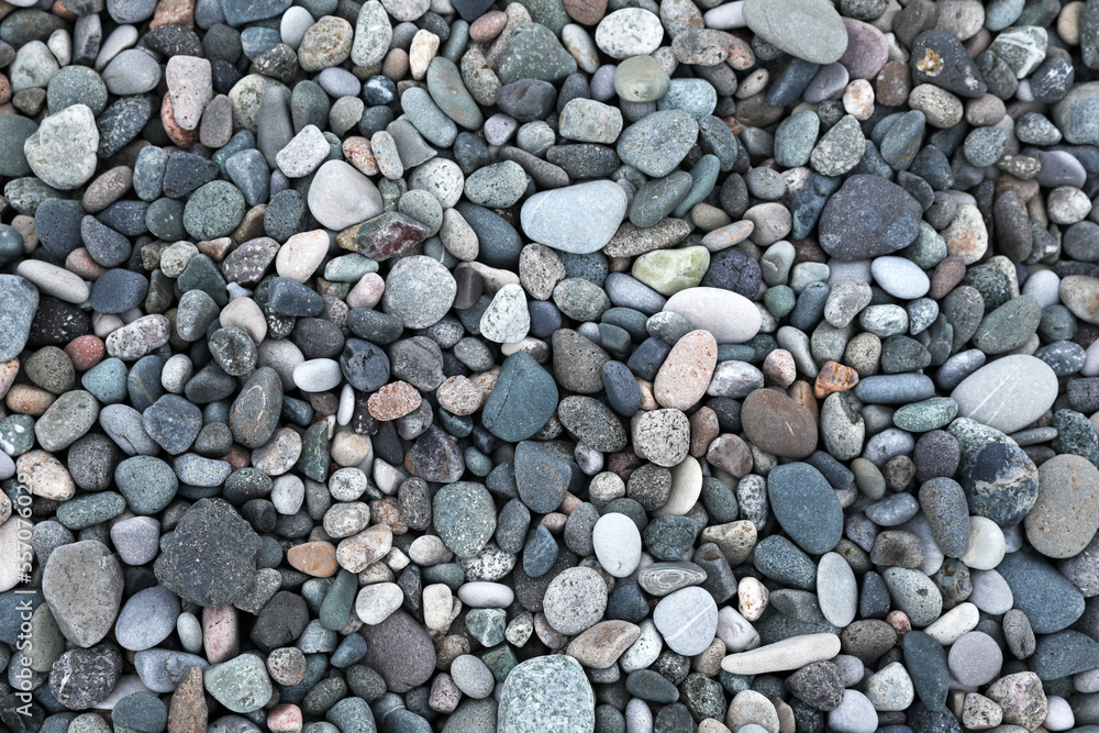 Many different pebbles as background, top view Many different pebbles as background, top view
