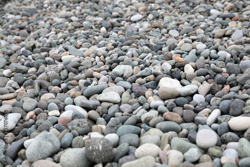 Many different pebbles as background, closeup view