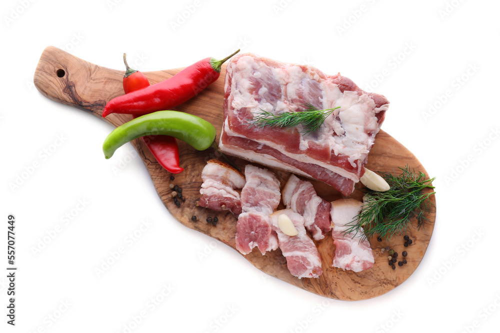 Pieces of pork fatback with chilli pepper and dill on white background, top view Pieces of pork fatback with chilli pepper and dill on white background, top view