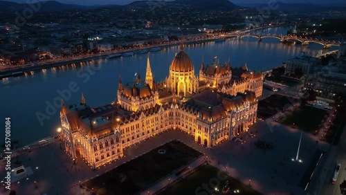 Aerial view of the illuminated Hungarian Parliament Building with the Danube river. Budapest, Hungary. Travel, tourism and European Political Landmark Destination