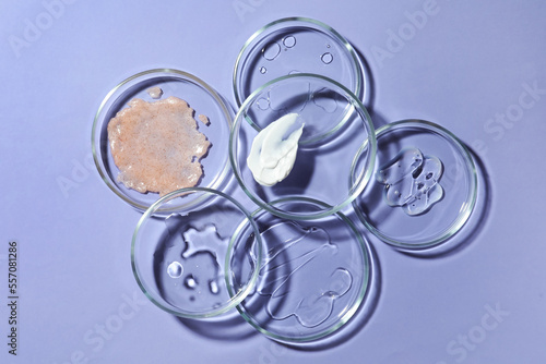 Flat lay composition with Petri dishes on lilac background