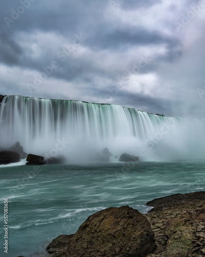 Roaring flowing water and mist from Horsehoe Falls - Niagara Falls. Ontario