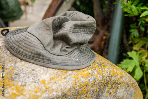 Old crumpled hat on rock photo