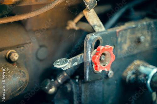 The gas pedal on the motoblock engine. Walk-behind tractor speed regulator photo