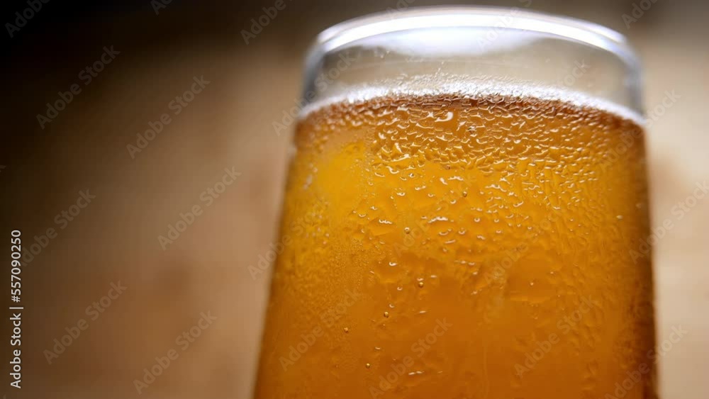 Drinking time: glass of beer.  Close-up of a cold beer glass. Drinking beer. Making drinks. A fresh beverage. Drinks for a party. Having fun. Happy hour. Beer isolated. Liquid. Alcohol. Cold beverages