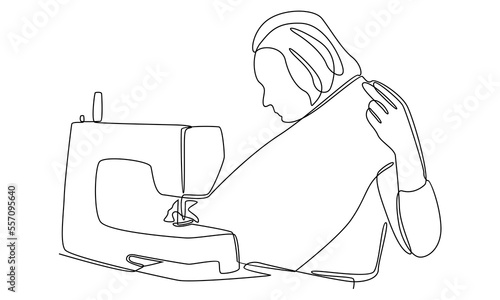 continuous line of woman using sewing machine