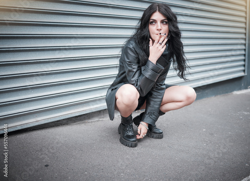 Cuadro en lienzo Punk, emo and woman smoking a cigarette in the street of an urban city in Canada in an edgy black outfit