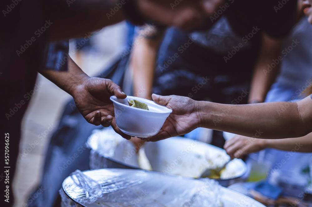 Providing free food from volunteers to the hungry poor : food donation concept, food sharing
