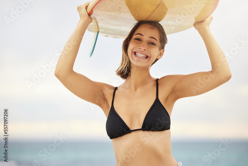 Photography Girl with surfboard, surfing and beach with fitness and adventure outdoor, young surfer and sports portrait in Australia