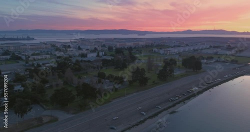 Aerial: Flying over decommissioned Alameda naval base at sunset, San Francisco, California, USA photo