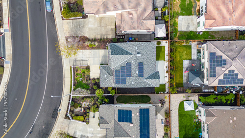 Top Down aerial photos over a community in California with homes with solar panels and roadways and parks