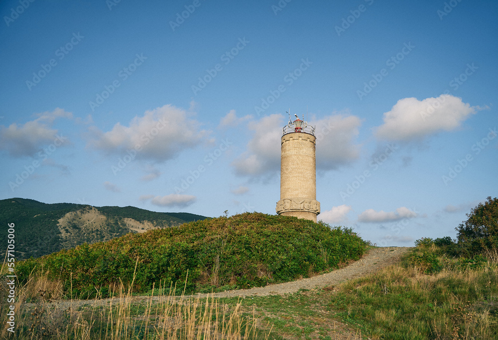 sea lighthouse on a hilly shore
