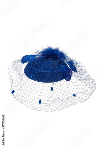 Close-up shot of a dark blue felt pillbox hat with a veil decorated with feathers. The hat with an alligator clip is isolated on a white background. Front view.