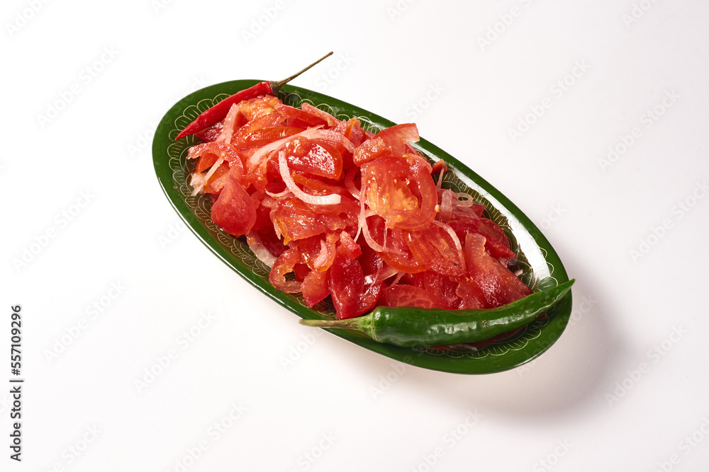 tomato and onion achuchuk salad on a white background