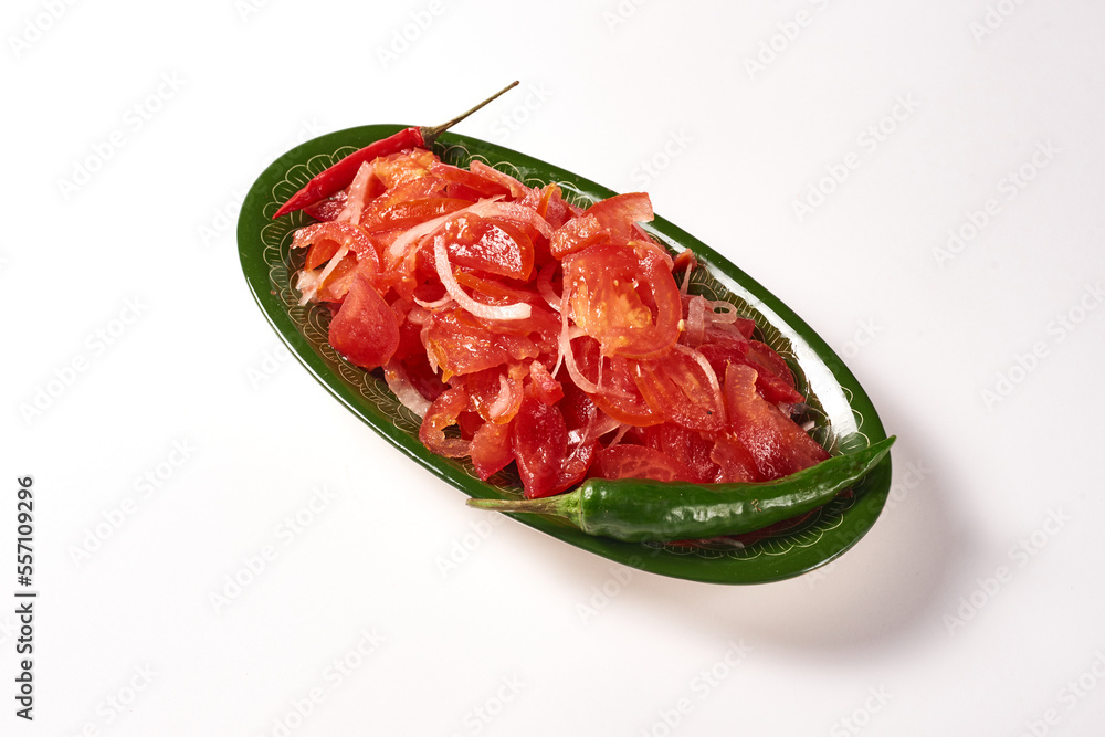 tomato and onion achuchuk salad on a white background tomato and onion achuchuk salad on a white background