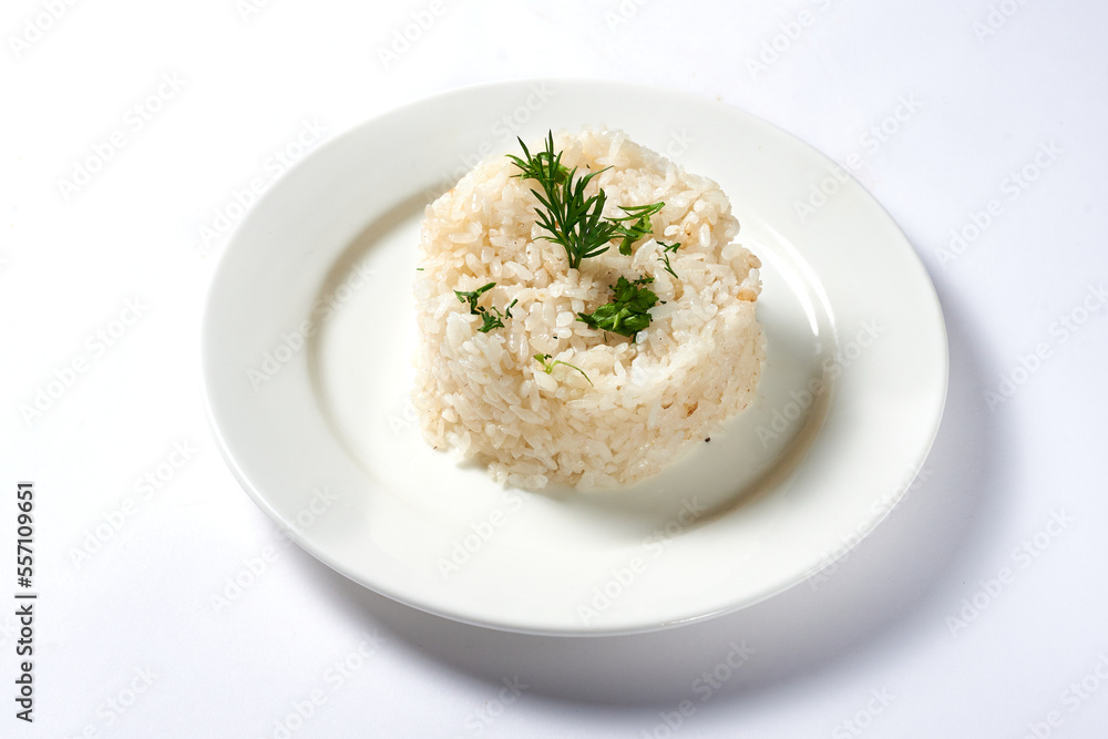 boiled rice with a dill branch on a white background