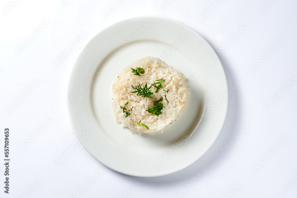 boiled rice with a dill branch on a white background boiled rice with a dill branch on a white background
