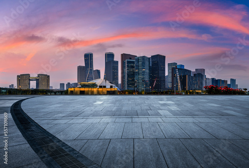 Empty floor and modern city skyline with building at sunrise in Hangzhou  China.