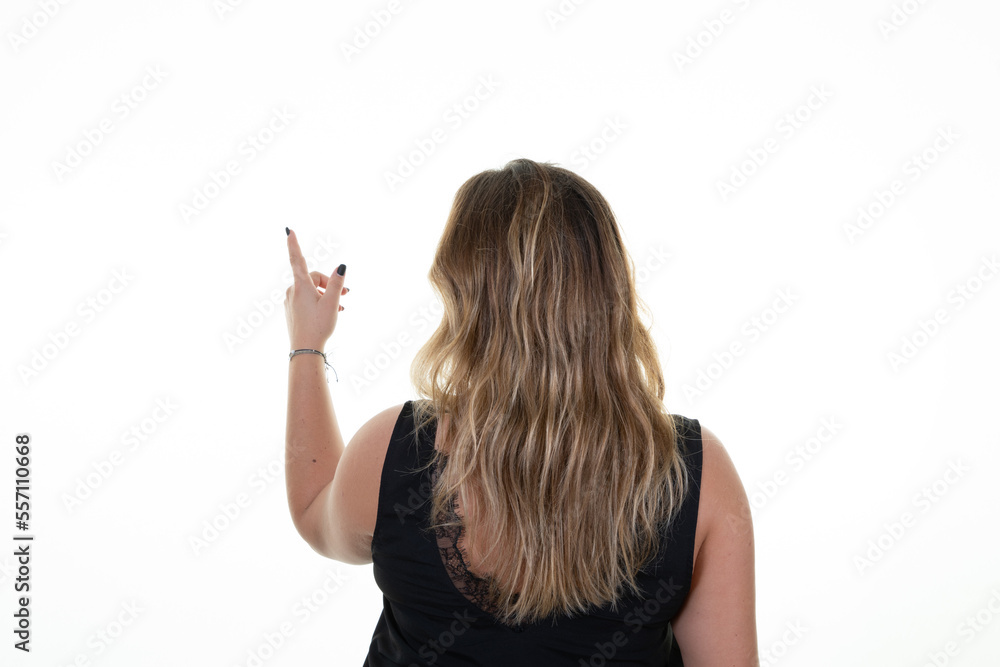 overweight woman standing behind pointing to side object on white empty copy space rear view overweight woman standing behind pointing to side object on white empty copy space rear view